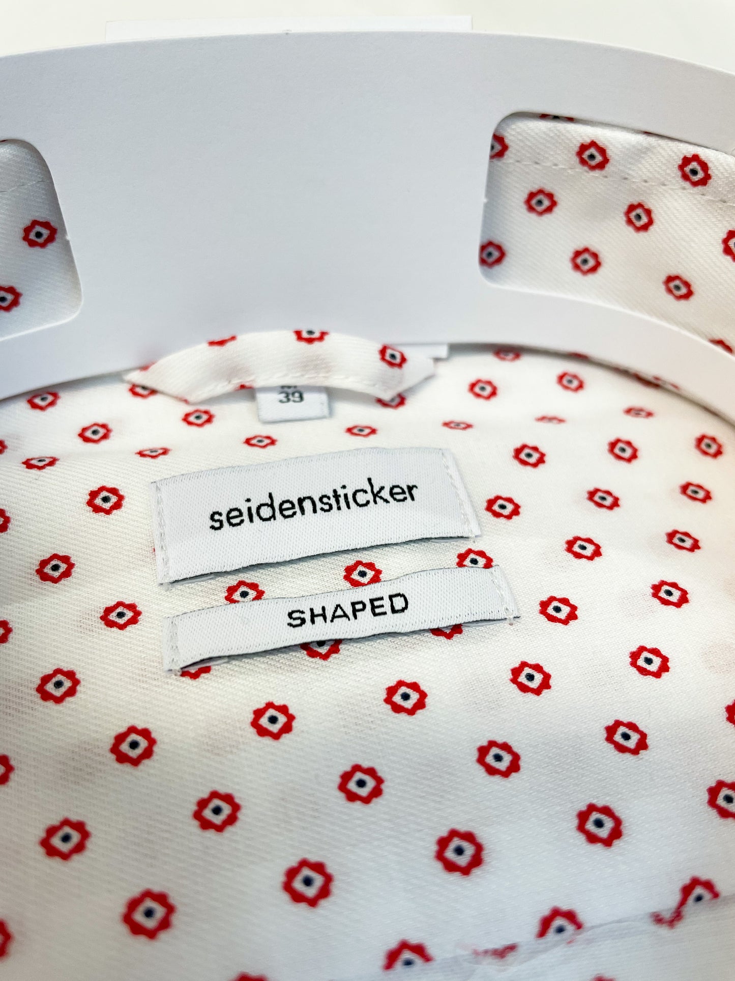 White Shirt with Red Spot