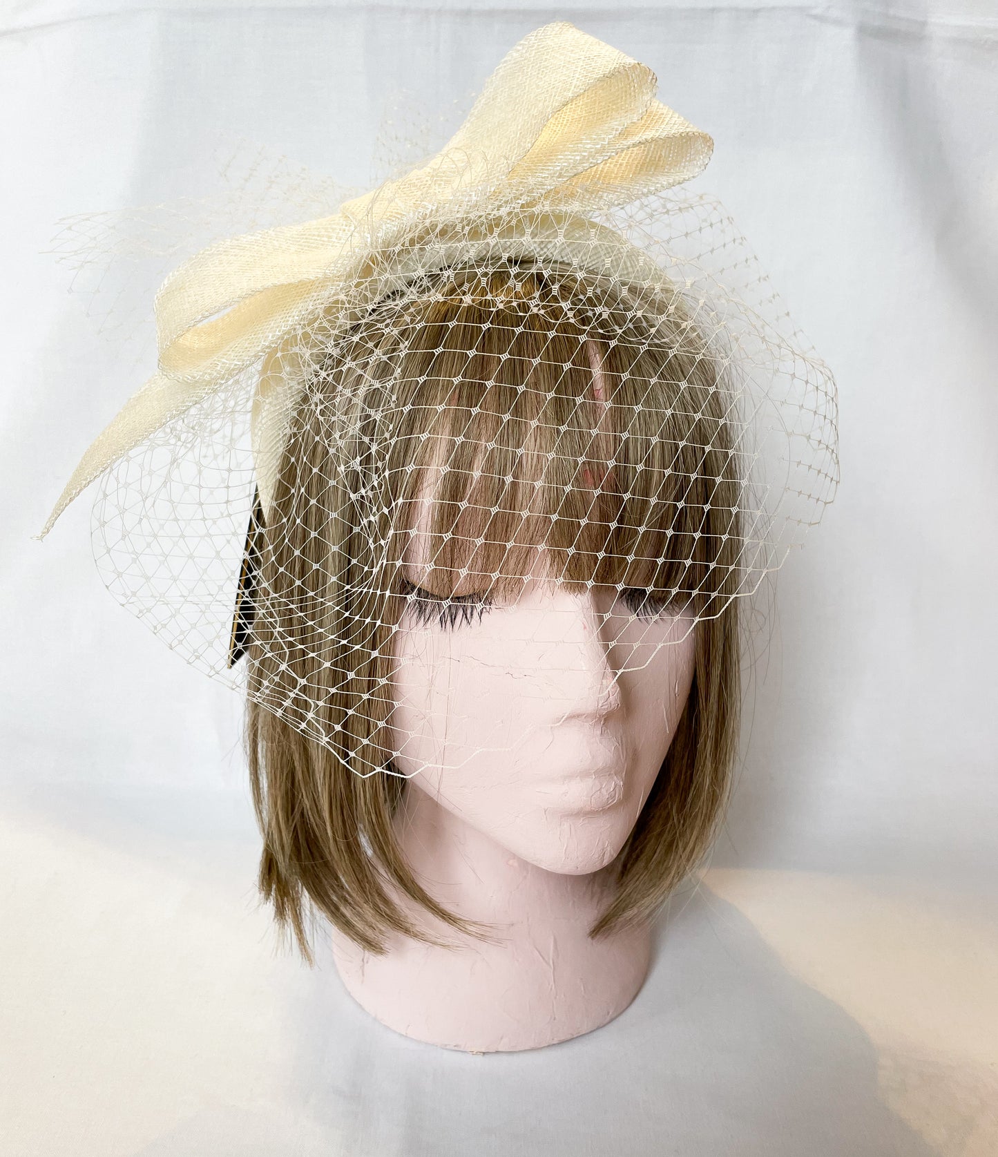 Ivory veiled fascinator