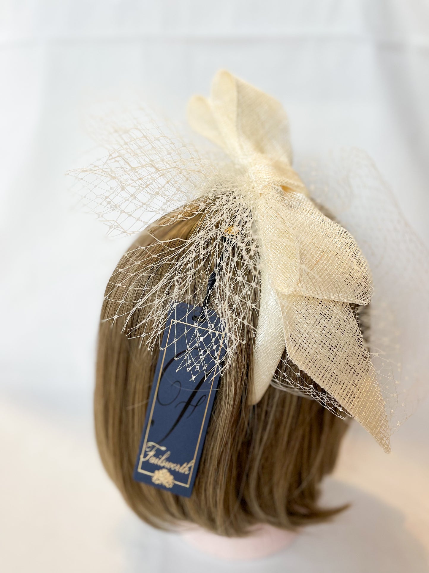 Ivory veiled fascinator