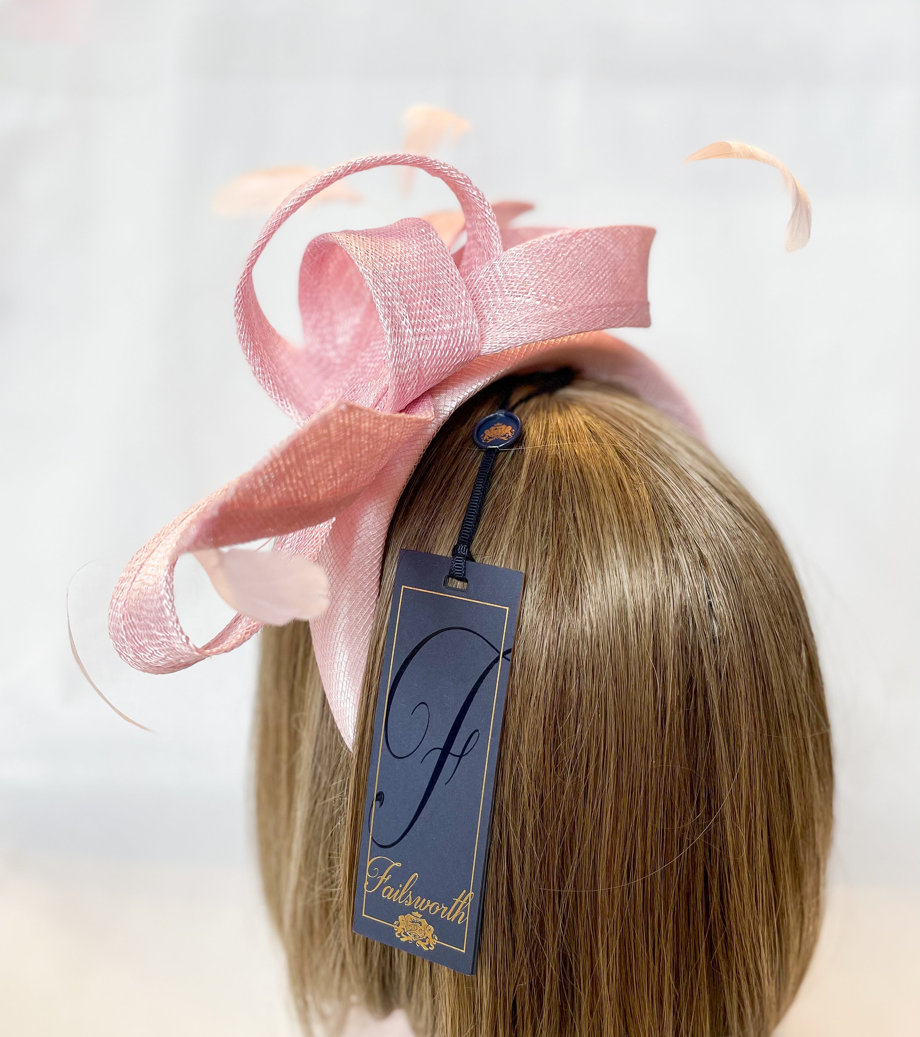 Pale pink bow fascinator